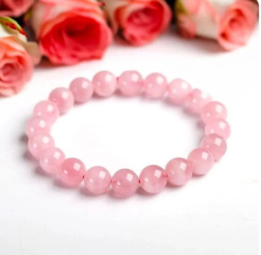 Natural rose quartz bead bracelet displayed on a neutral surface for daily wear