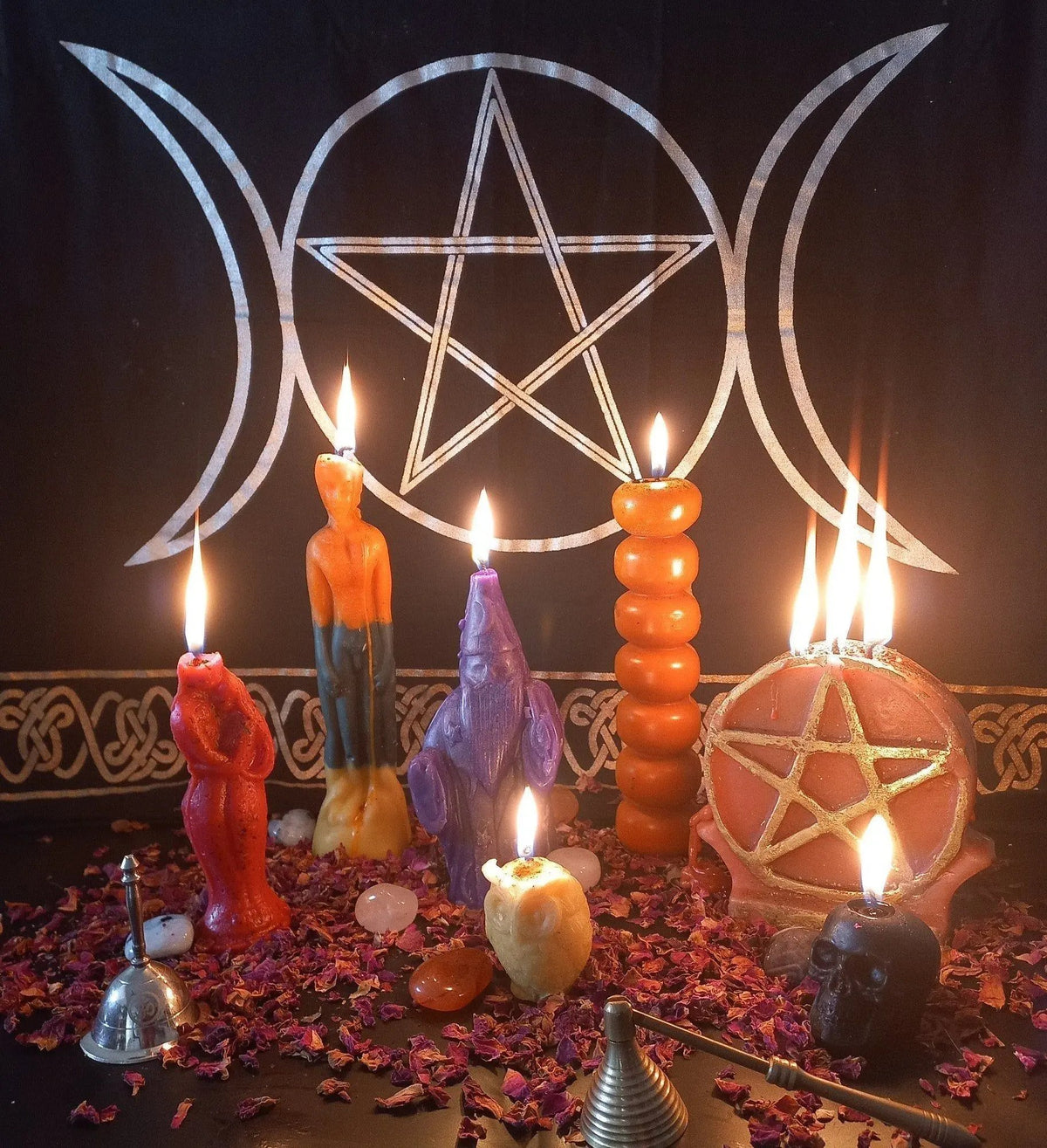 A lit candle placed on a table during a guided candle healing session for relaxation