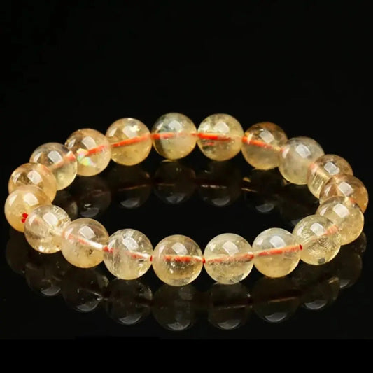AAA natural citrine beaded bracelet displayed on a plain surface for everyday wrist styling and crystal collection.