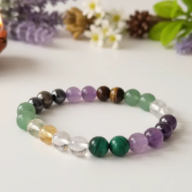Money magnet bracelet displayed on a neutral background for spiritual jewelry accessory