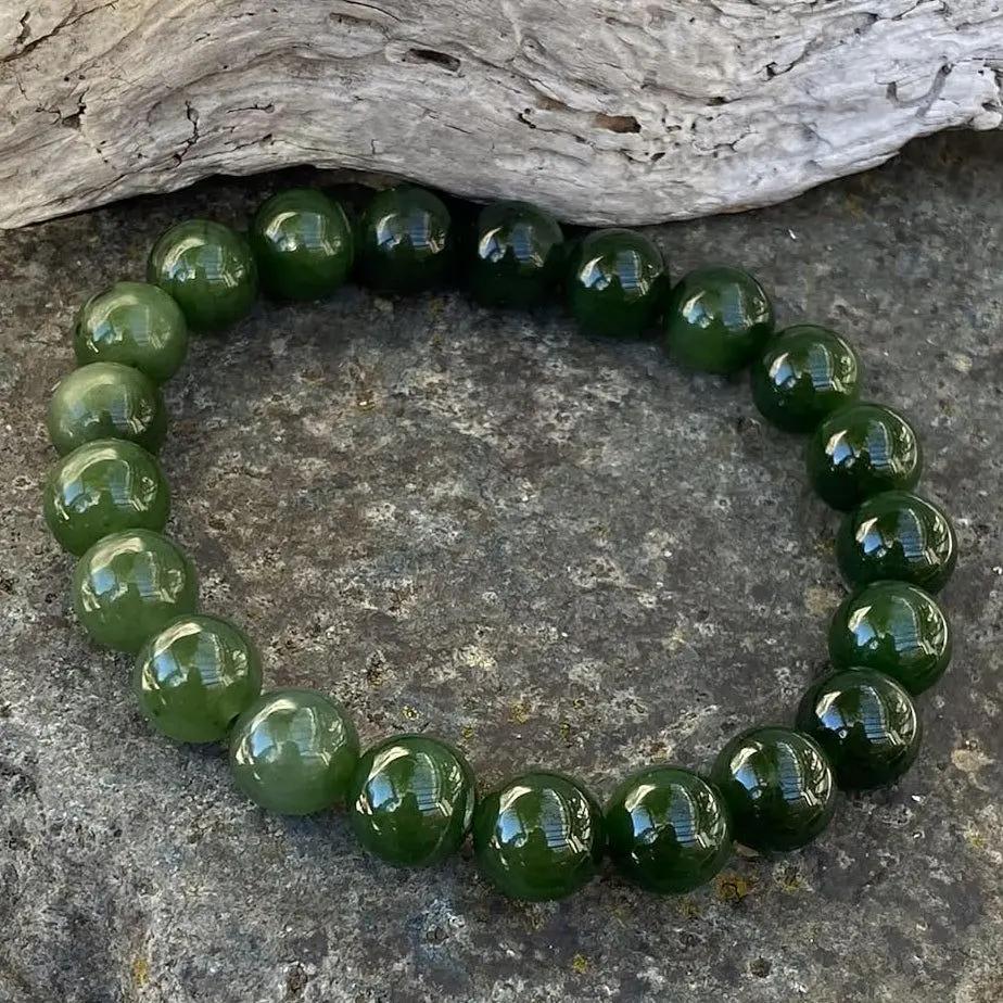 Canadian nephrite jade bracelet featuring smooth green beads on a stretch cord for everyday wear.