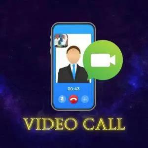 Tarot reading video call session showing spread cards on a table next to a laptop screen