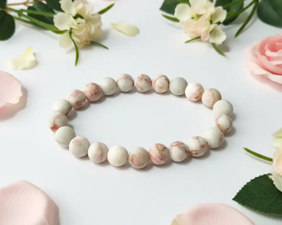 Picasso jasper beaded bracelet displaying polished round stones with natural brown and cream patterns.