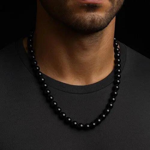 Black tourmaline pendant necklace displayed on a neutral background for daily wear.