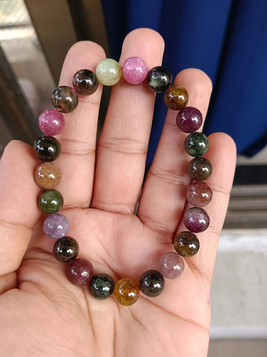 Multi tourmaline bracelet with assorted natural stone beads displayed on a neutral background for casual wear.