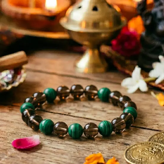 Green malachite and dark smoky quartz beaded bracelet arranged in a circle for daily wear.
