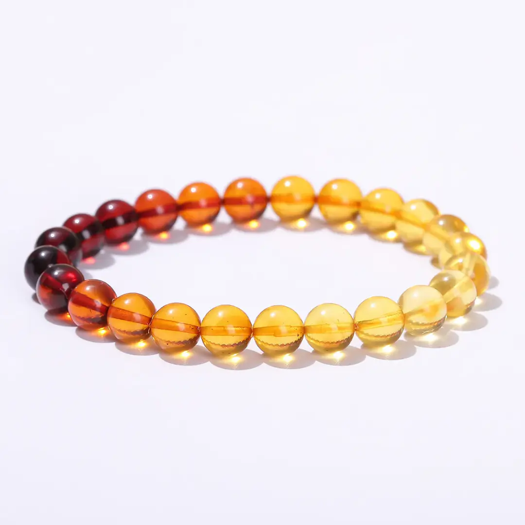 Baltic amber bracelet with polished guardian amber beads displayed on a neutral background.