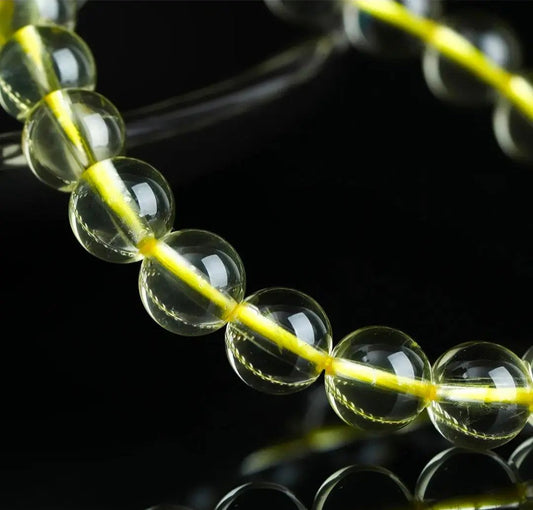 Rare lemon quartz beaded bracelet featuring smooth polished stones arranged for everyday wrist wear