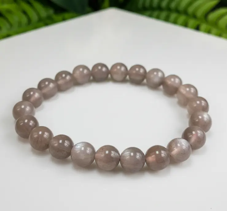 Gray moonstone beaded bracelet displayed on a neutral background for product viewing.