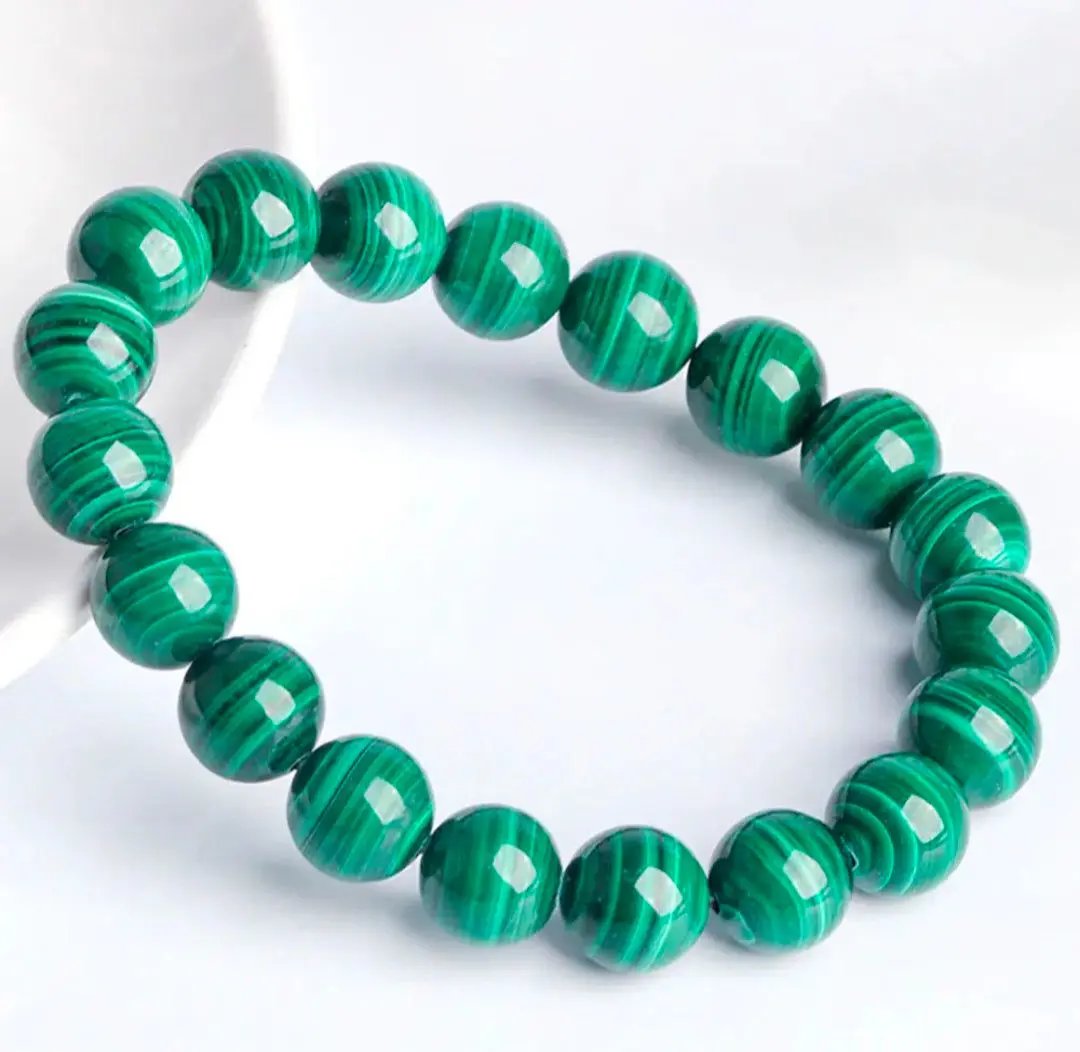 AAA malachite beaded bracelet with polished green gemstone beads on elastic string for everyday wear.
