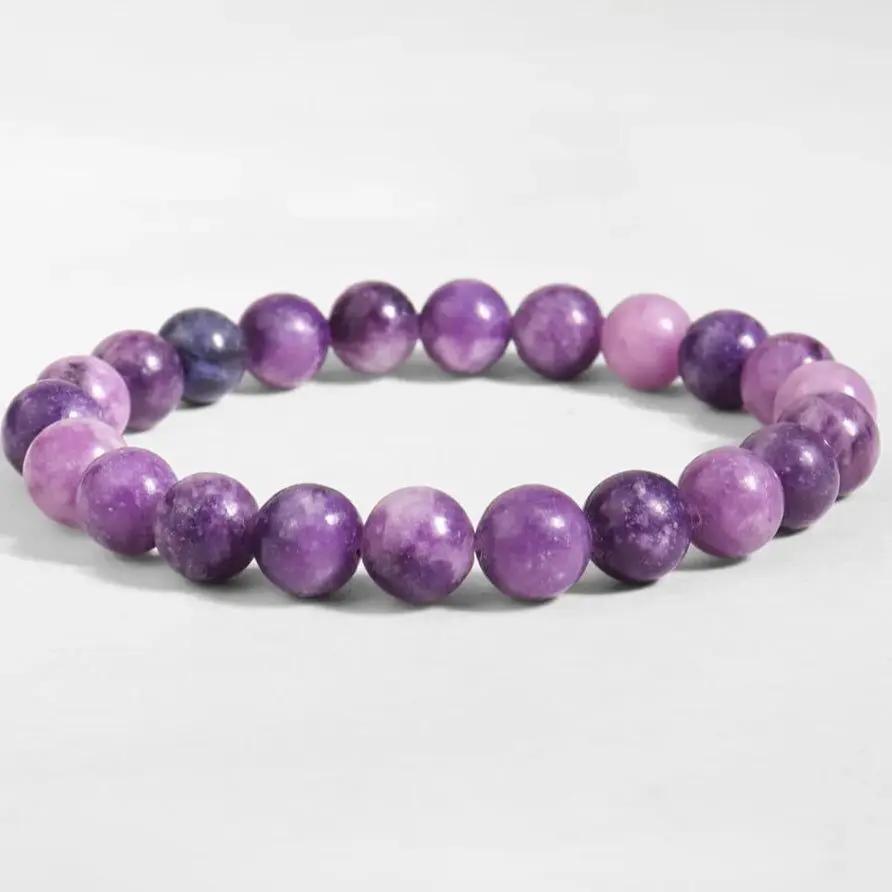 AAA lepidolite beaded bracelet featuring polished purple stones displayed on a neutral background