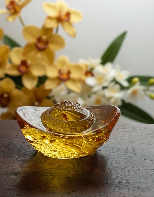 Gold ingot shaped decorative piece representing wealth and prosperity for home display