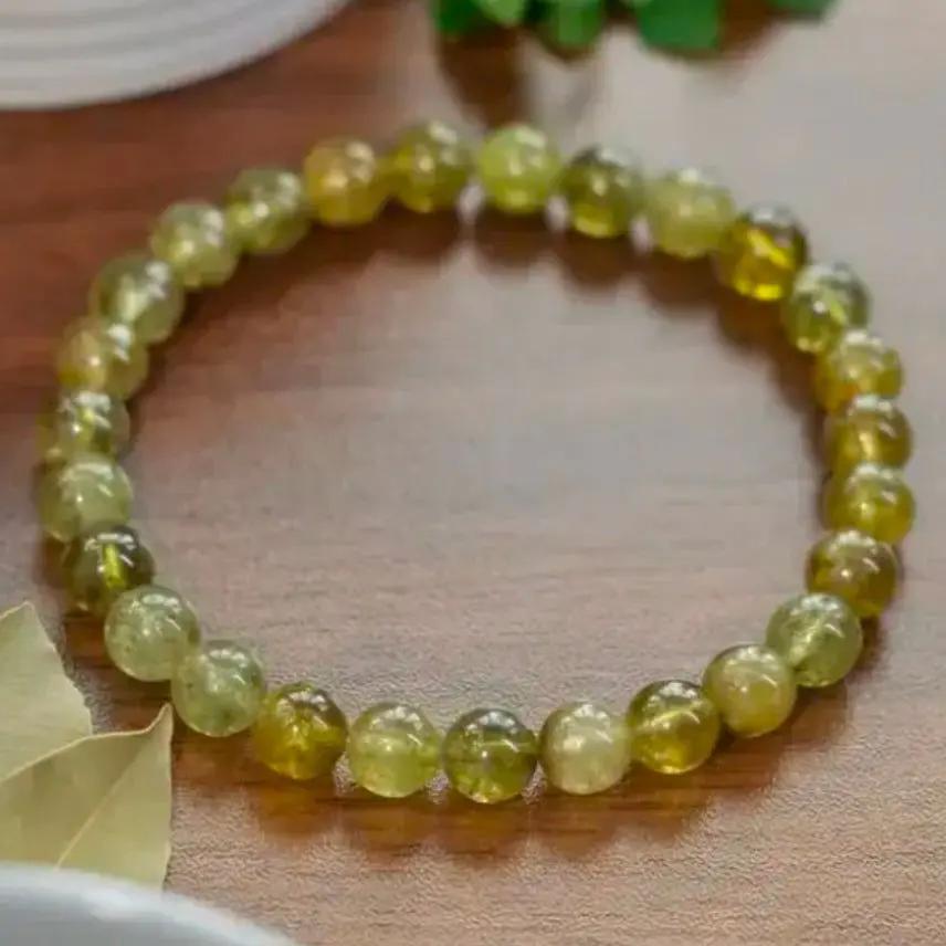 AAA grade green tsavorite garnet beaded bracelet displayed on a neutral surface for daily wear