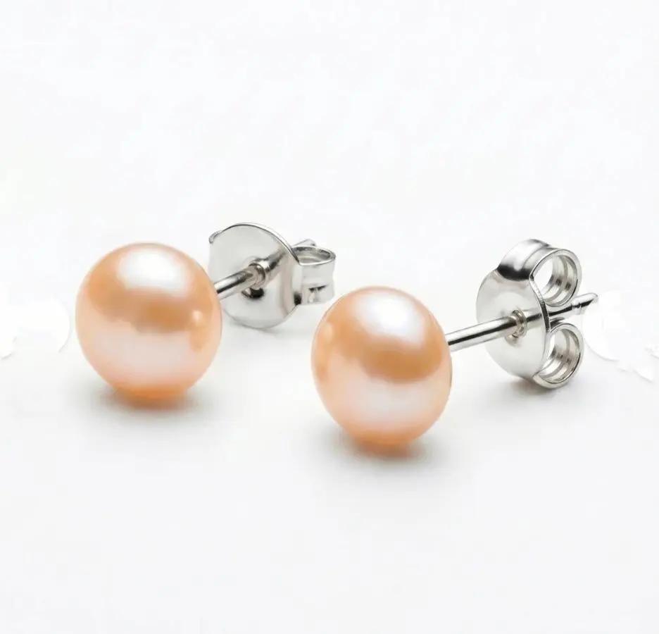 Pair of eight millimeter real pearl stud earrings set in sterling silver posts