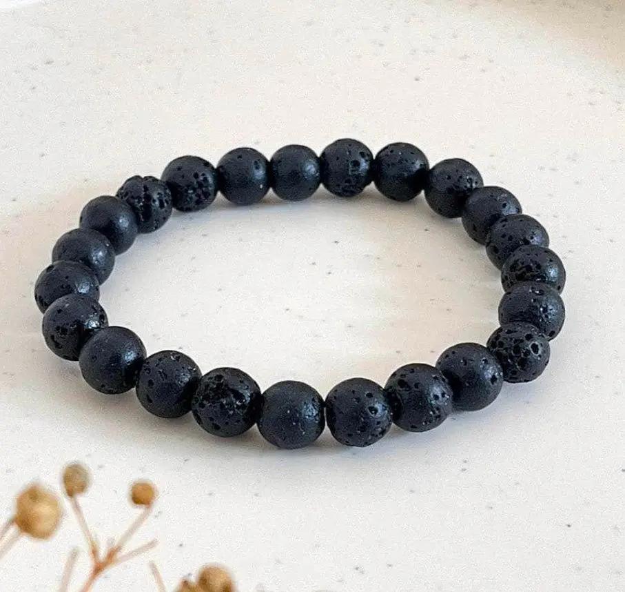 Natural lava stone beaded bracelet displayed on a neutral background for essential oil diffusion and daily wear.