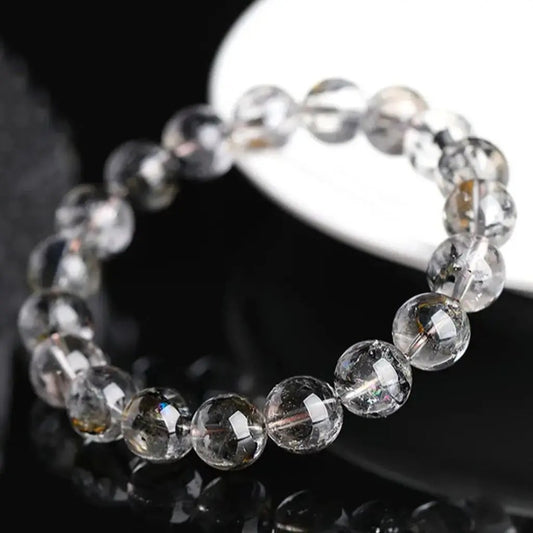 Herkimer diamond bracelet worn on a wrist showing clear natural crystal beads