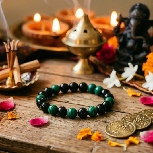Green malachite and black obsidian beaded bracelet displayed on a neutral background for everyday wear